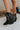 The Zane Western Bootie features a black leather upper, an almond toe, western inspired embroidery through out, side pull tabs for easy entry/exit, and a 3" block heel.