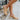 The Sutton Mule is a lug sole, mule style, featuring a nude leather upper, a slip-on entry, and a lug sole.