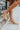 The Sutton Mule is a lug sole, mule style, featuring a nude leather upper, a slip-on entry, and a lug sole.