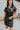 Frontal view of the Can't Live Without Mini Dress that features a black faux-leather material, a collar neck, a short cuffed sleeve, a button-up front, two front pockets at the chest, two front pockets at the bottom, and a mini length.