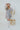 Frontal view of the Maybe My Soulmate Dress that features an ash blue colored chiffon material, a multi-colored floral print, a V neckline, a long sheer sleeve, ruching at the bust, a bottom ruffle tier, a smocked back, and a mini length.