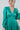 Frontal view of the A Vision Mini Dress that features a green satin material, a monochromatic floral print, a V neckline, a long puffy sleeve, button detailing at the front, a zipper back closure, and a flowy fit.