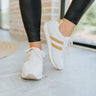 The Got To Go Sneaker features an ivory corduroy upper with grey colored suede paneling, a grey colored suede heel, a camel colored heel tab, two camel colored side stripes, and a lace-up closure.
