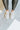 The Got To Go Sneaker features an ivory corduroy upper with grey colored suede paneling, a grey colored suede heel, a camel colored heel tab, two camel colored side stripes, and a lace-up closure.