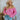 Frontal view of the Keep On Dreamin' Sweater that features a fuchsia knit material, a knit pattern, a V neckline, a long cuffed sleeve, and a V back with an adjustable tie closure.