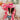 The Road Less Traveled Hat is a wide brim hat, featuring a hot pink fabric, a white aztec pattern belt, and adjustable ties within for different fit.