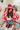 The Road Less Traveled Hat is a wide brim hat, featuring a hot pink fabric, a white aztec pattern belt, and adjustable ties within for different fit.