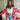 Frontal view of the Simple Times Cardigan that features a pink knit material with an ivory checkered pattern, an open front, and oversized long sleeves.