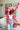 Frontal view of the Simple Times Cardigan that features a pink knit material with an ivory checkered pattern, an open front, and oversized long sleeves.