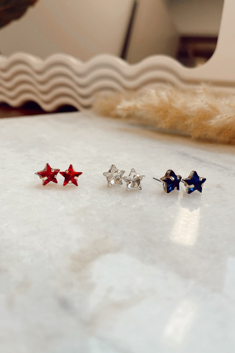 The Stars In Your Eyes Earring Set features star shaped stud with blue, red and clear stones and set in gold.