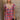 Front view of model wearing the Ever So Sweet Dress which features orange, pink, navy blue, purple, white and brown knit fabric, plaid pattern, white lining, mini length, pockets on each side, plunge neckline, ruffle elastic straps and open back with bow 