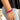 Front view of model wearing the Half and Half Bracelet in Fuchsia which features three stack of stretchy bracelets with small gold beads, small fuchsia beads and large fuchsia beads.