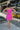 Full body back view of model wearing the Sweet Summertime Dress that features hot pink fabric, a v-neckline, and tie straps