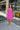 Full body front view of model wearing the Sweet Summertime Dress that features hot pink fabric, a v-neckline, and tie straps