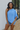 Front view of model wearing the Tried-and-True Blue Top which features blue fabric, an off-the shoulder neckline, and one short sleeve.
