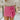 Front view of model wearing the Always On My Mind Skort that has pink fabric, a skirt overlay with shorts in the back, a front bow detail, a pink lining, and a monochromatic side zipper with a hook closure