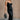 Full body front view of model wearing theElisa Black Satin Cowl Neck Maxi Dress that havs black satin fabric, maxi length,, a cowl neck, adjustable straps, and a back zipper with a hook closure.