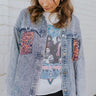 Front view of model wearing the Life Of The Party Denim Jacket that has acid wash denim with distressing, a button up front with a collar, pink and blue sequin pockets, silver bead fringe and long sleeves 