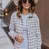 Front view of model wearing the Yours Truly Shacket in Grey that has a grey and cream checkered pattern, a button-up front, chest pockets, side pockets, a collar, and long sleeves.
