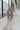 Full body view of model wearing the Once Upon A Time Blazer which features light blue fabric, two front pockets, a collared neckline, and 3/4 sleeves with ruched details.