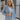 Front view of model wearing the Once Upon A Time Blazer which features light blue fabric, two front pockets, a collared neckline, and 3/4 sleeves with ruched details.