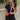 Front view of model wearing the Bring It On Romper that has black stretchy fabric, a romper body, a monochromatic front zipper, a round neckline, and short sleeves.