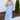 Front view of model wearing the Living In A Fairytale Midi Dress that has periwinkle organza pleated fabric, periwinkle lining, midi length, a square neck, and adjustable straps.
