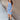 Full body front view of model wearing the Long Beach Dress that has light blue ribbed fabric, midi length, a round neckline, and thick straps.