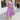 Front view of model wearing the Love Struck Floral Midi Dress that has shimmery sheer purple fabric with a blue, turquoise, and red floral print, purple lining, a ruffle hem, a square neck, and 3/4 puff sleeve with elastic trim.