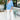 Full body front view of model wearing the Better Days Top in Blue that has blue satin fabric, a round low neckline, and 3/4 flare sleeves