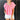 Front view of model wearing the All About Me Top which features pink gauze fabric, a square neckline, short flare sleeves, and an open back with a tie closure.