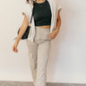 Full body view of model wearing the Ava Light Taupe Cargo Lounge Pants which features light taupe cotton knit fabric, an elastic waistband, two side pockets, two side cargo pockets and wide legs.