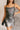 Front view of model wearing the Amber Gunmetal Cowl Neckline Sleeveless Mini Dress which features gunmetal grey shimmer fabric, mini length, black lining, a cowl neckline, adjustable straps, and a monochromatic back zipper with a hook closure.