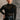 front view of model wearing the Anastasia Black Embellished Mesh Top that has black mesh fabric, silver embellishments, exposed seam details, a high neckline, and long sleeves.