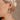 Front view of model wearing the Jenna Multi & Pearl Beaded Earring which features teardrop shaped filled with pearls and multi color rhinestone design, set in gold.