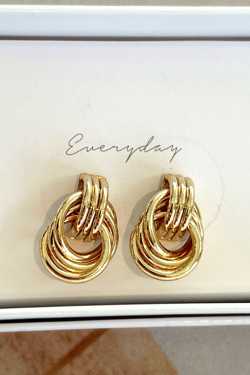 Close-up view of the 'everyday' gold double hoop earrings.