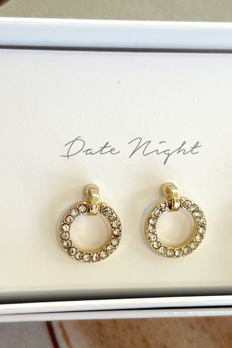 Close-up view of the 'date night' gold circle earrings with rhinestones.