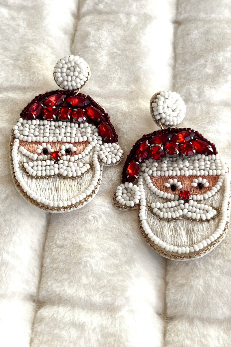 Close image of the Ho Ho Ho Earrings that feature Santa-shaped embroidered pendants with red and white beaded embellishments.