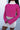 Front view of model wearing the Future Is Bright Sweater in Pink, that has hot pink ribbed knit fabric, a cropped waist, a round neckline, and balloon sleeves with cuffed wrists