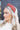 Side view of model wearing the Sadie Headband in Rust, which features a structured band with a satin lining and a quilted exterior with a top twist.