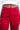 Close up view of model wearing the Endless Love Pant which features red satin fabric, geometric pattern, zipper and hook closure, two back pockets, belt loops and straight wide leg.