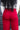 Close up back view of model wearing the Endless Love Pant which features red satin fabric, geometric pattern, zipper and hook closure, two back pockets, belt loops and straight wide leg.