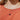Close up view of model wearing the Ultimate Jewel Necklace which features double layer gold chain with black circle stone and gold circle medallion.