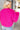 Close up back view of model wearing the Make A Statement Jacket which features hot pink soft shag fabric, hidden button closures, two front pockets, cropped waist and long balloon sleeves. 