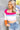 Close up view of Whitney Color-Block Sweater which features pink, white, blue, purple and orange ribbed stripe fabric, a cropped waist, a square neckline, and long sleeves.