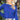 Close up view of model wearing the Talk About It Sweater which features royal blue ribbed knit fabric, a cropped waist, a round neckline and balloon sleeves with cuffed wrists.