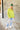 Full body view of model wearing the Ready Or Not Sweater In Lime which features lime knit fabric, slits on the hem, a round neckline, drop shoulders and balloon long sleeves with fitted wrists.