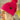 Side view of model wearing the Fireside Beanie in Pink, that features pink knit fabric, a folded cuff with a brown "C.C" patch, and a pink pompom.
