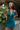 Close up front view of model wearing the Skylar Satin Dress in Teal which features teal satin fabric, halter neckline with a tie, ruching on the sides, back zipper with hook closures and lining.