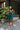 Full body view of model wearing the Skylar Satin Dress in Teal which features teal satin fabric, halter neckline with a tie, ruching on the sides, back zipper with hook closures and lining.